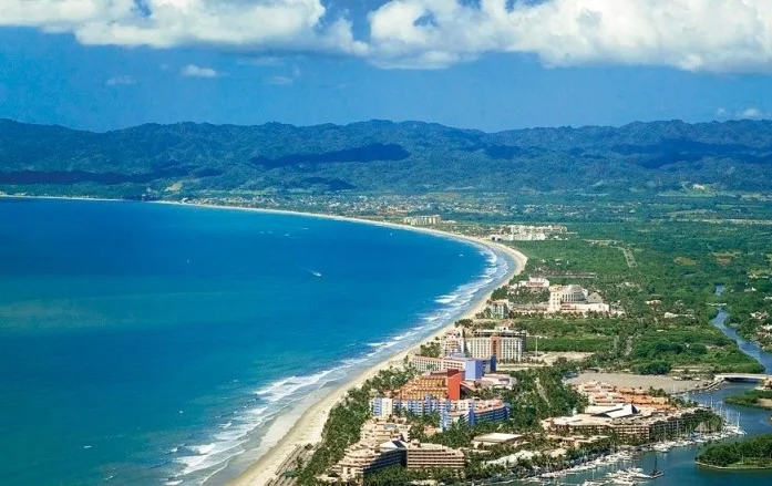Aerial view of the Riviera Nayarit coastline, showing the beach, resorts and mountains along Banderas Bay