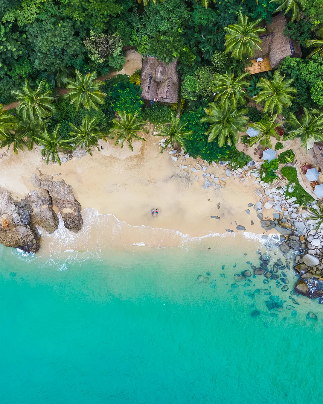 Aerial view of a hidden cove on Puerto Vallarta's south coast, surrounded by jungle
