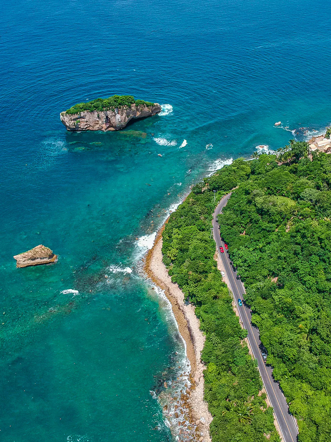 Aerial view of the Los Arcos rock islets off the coast, next to the coastal road toward Mismaloya
