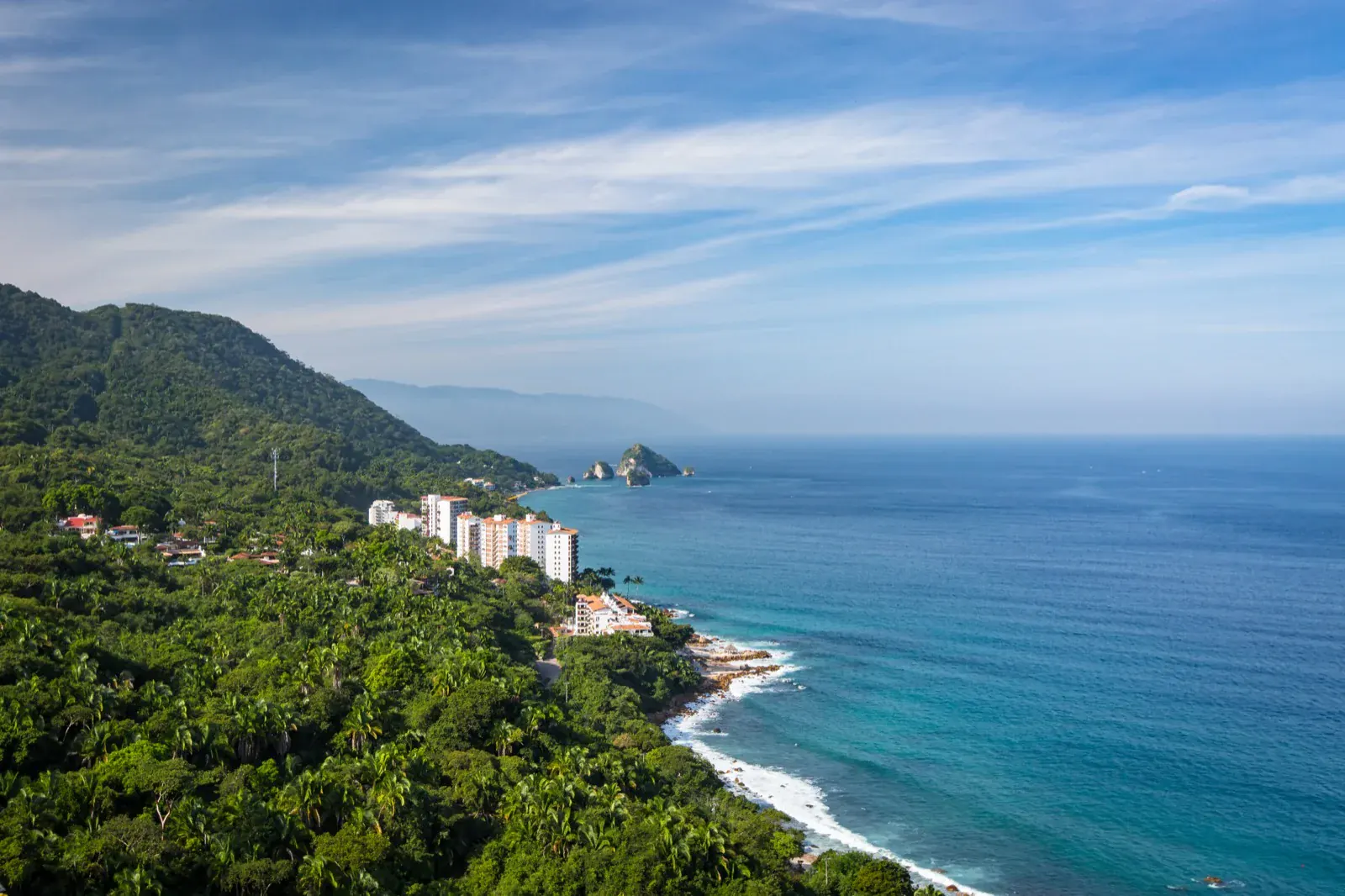 Aerial view of Puerto Vallarta's south coast, where beachfront condos give way to rocky coastline and jungle