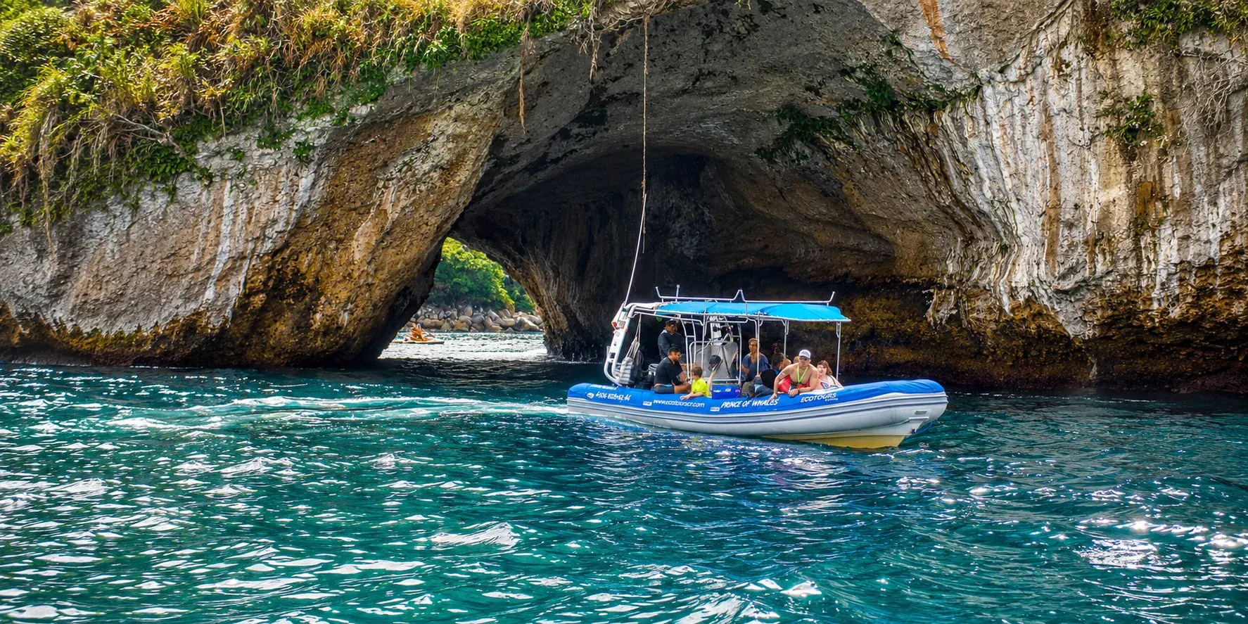 Couple snorkeling underwater making a heart shape with their hands