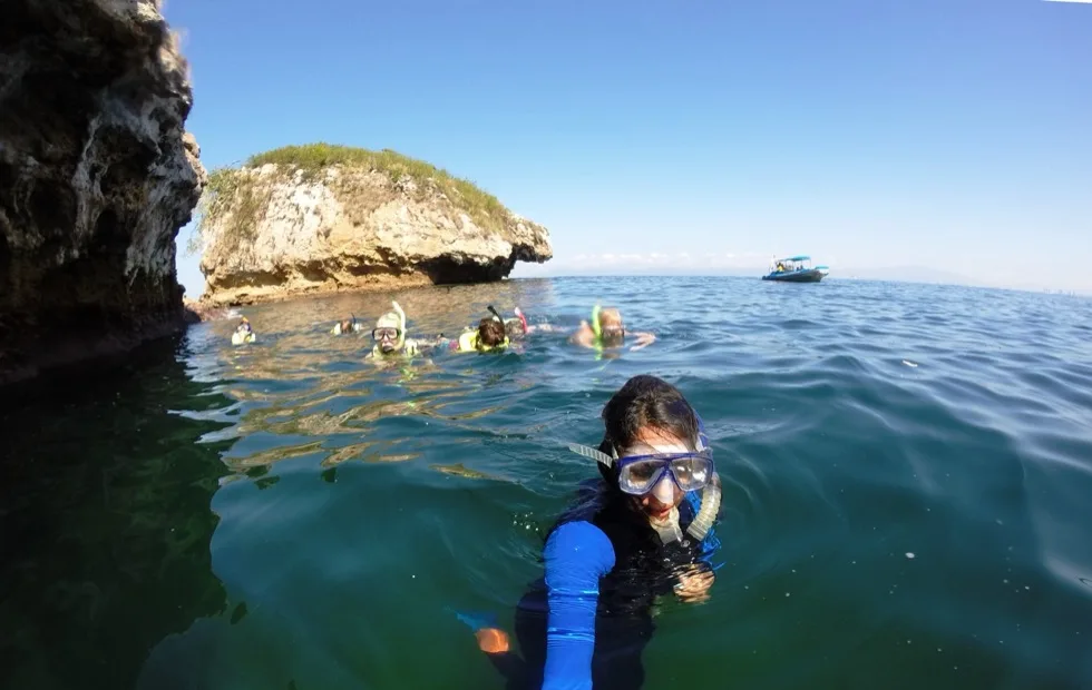 Group of snorkelers near the Los Arcos rock walls