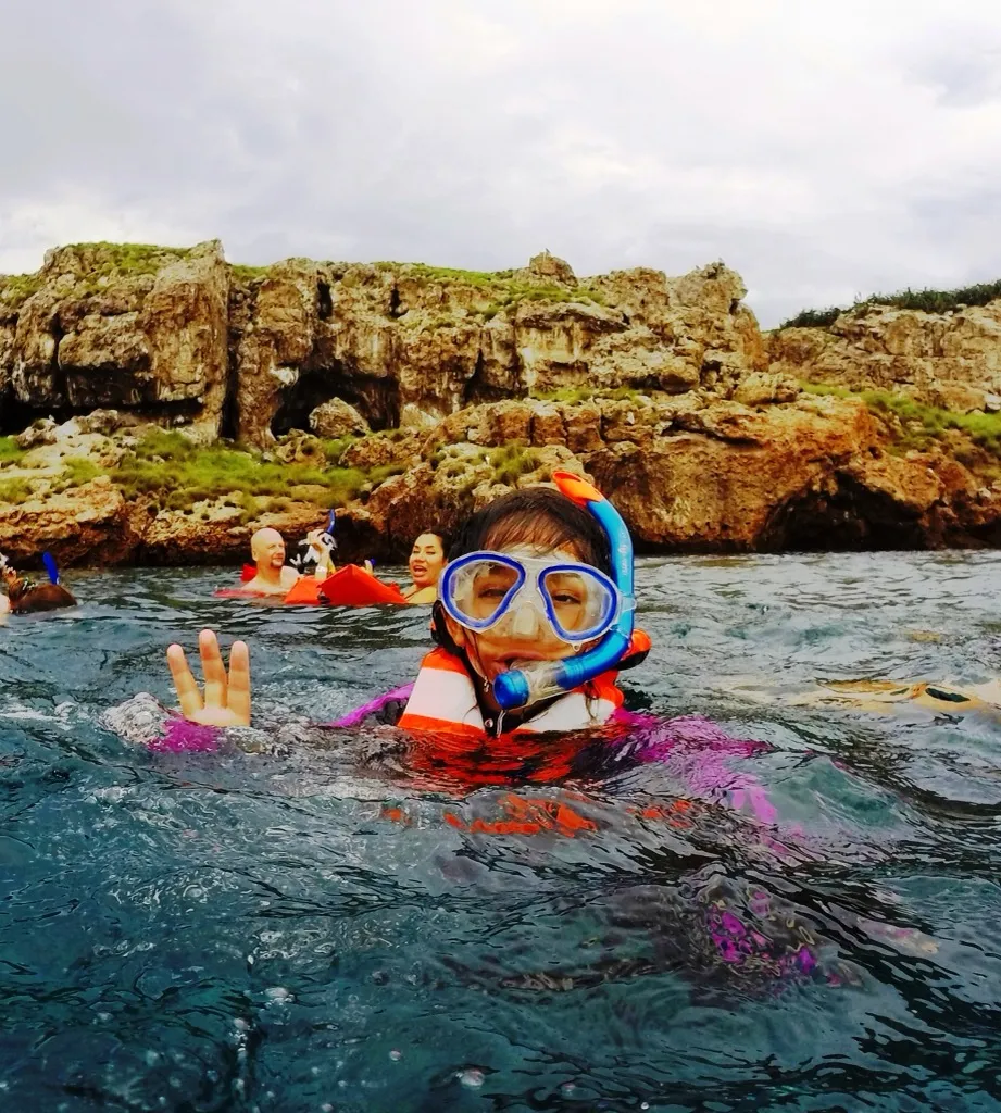 Snorkeler waving at the camera near Islas Marietas