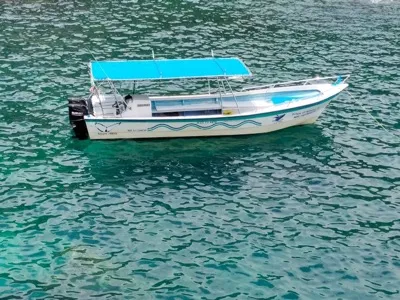 Private charter boat anchored in clear turquoise water near Puerto Vallarta