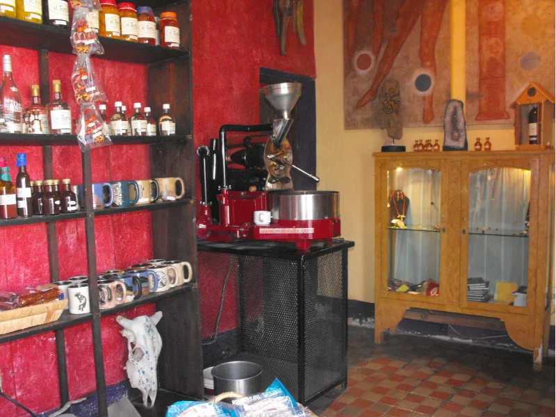Interior of a local coffee shop with roasting equipment and gifts