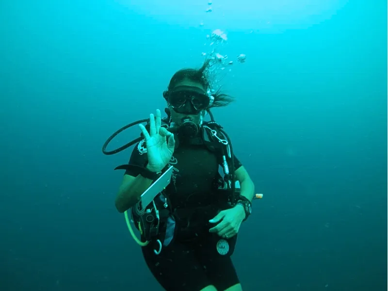 Diver giving the OK sign underwater