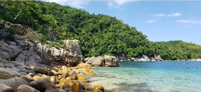 Rocky cove with clear turquoise water along the Yelapa coastline